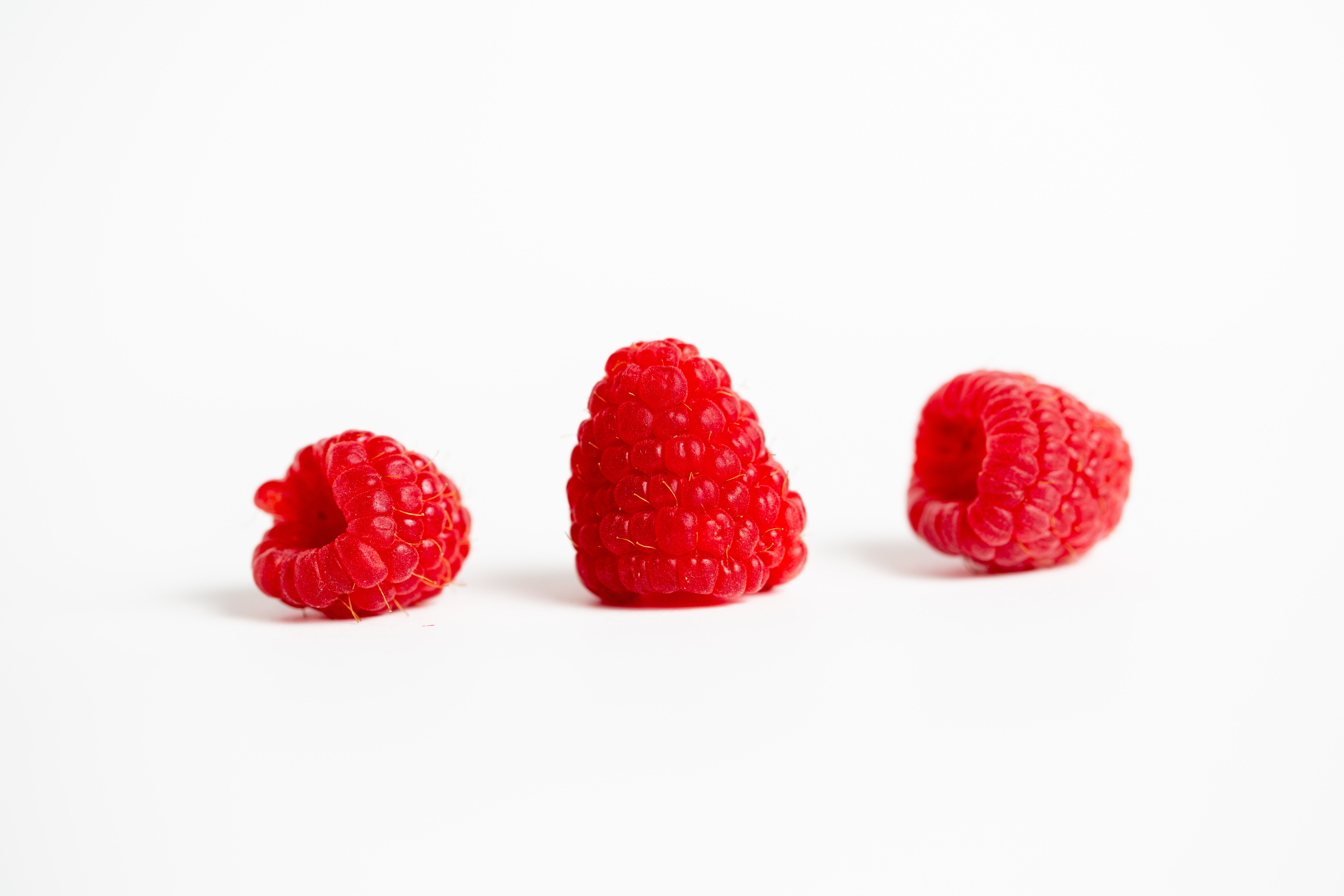 three-raspberries-isolated.jpg