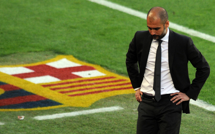 barcelonas-coach-pep-guardiola-looks-down-during-the-el-clasico-soccer-match-against-real-madrid-at-nou-camp-stadium-in-barcelona-april-21-2012.jpg