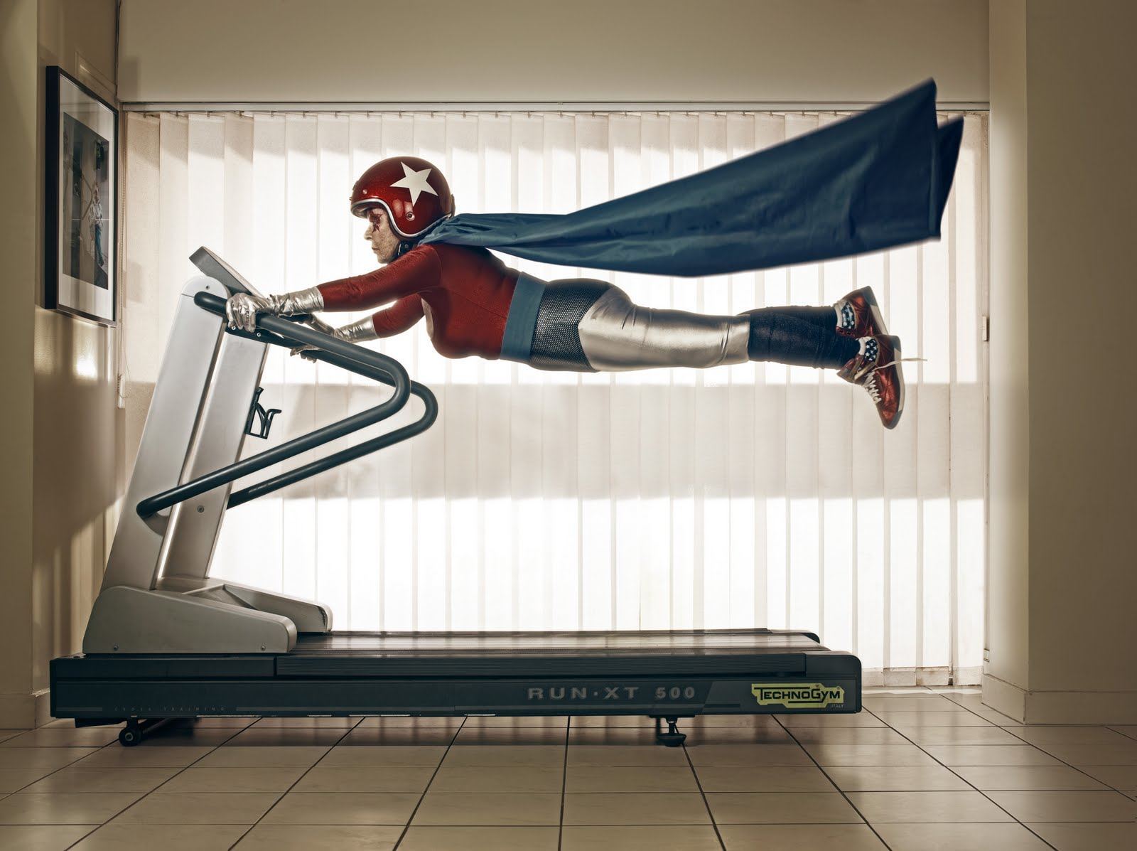 a-funny-photo-by-sacha-goldberger-of-his-grandmother-in-a-superhero-outfit-flying-on-a-treadmill.jpg