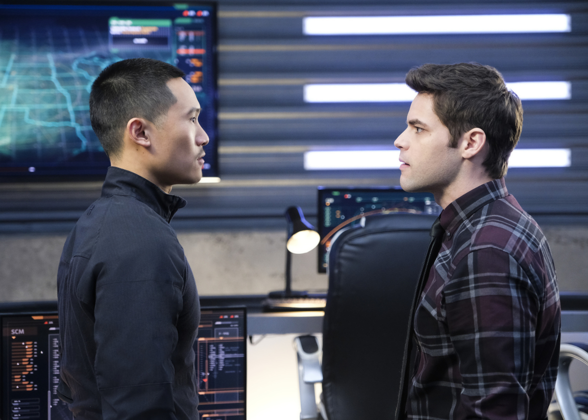 Supergirl -- ‘In Search of Lost Time‘ -- Image Number: SPG315a_0290.jpg -- Pictured (L-R): Curtis Lum as Agent Demos and Jeremy Jordan as Winn -- Photo: Robert Falconer/The CW -- ÃÂ© 2018 The CW Network, LLC. All Rights Reserved.