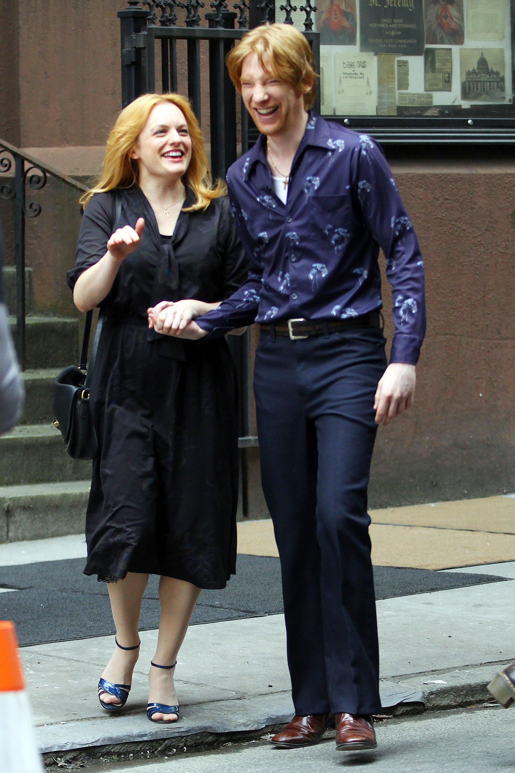 Elisabeth Moss and Domhnall Gleeson are caught in a candid moment while filming The Kitchen.