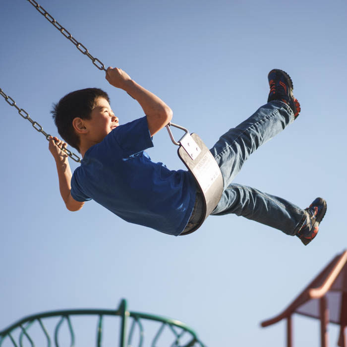 kid-playing-on-a-swingset.jpg