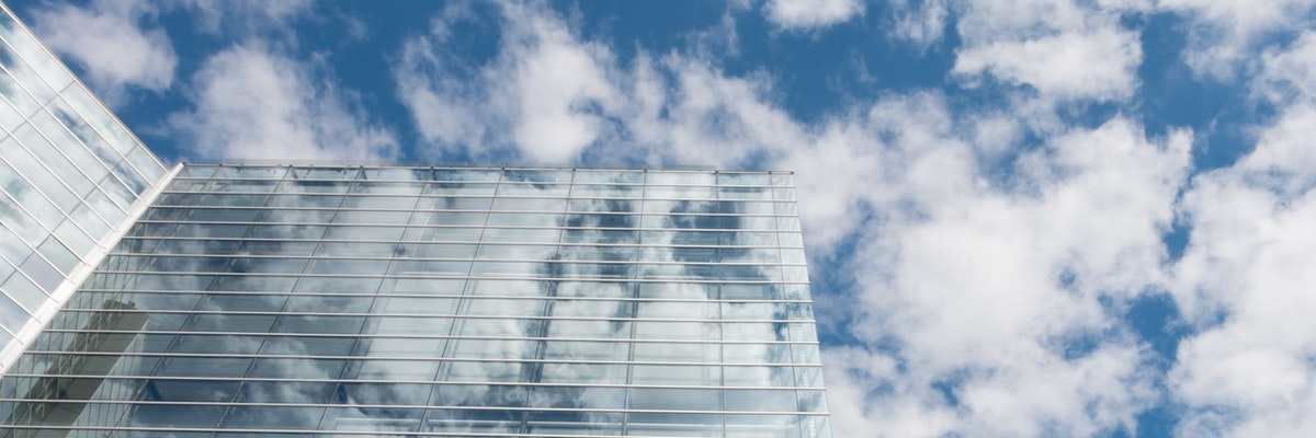 bottom-view-of-clear-glass-building-under-blue-cloudy-sky-164444.jpg