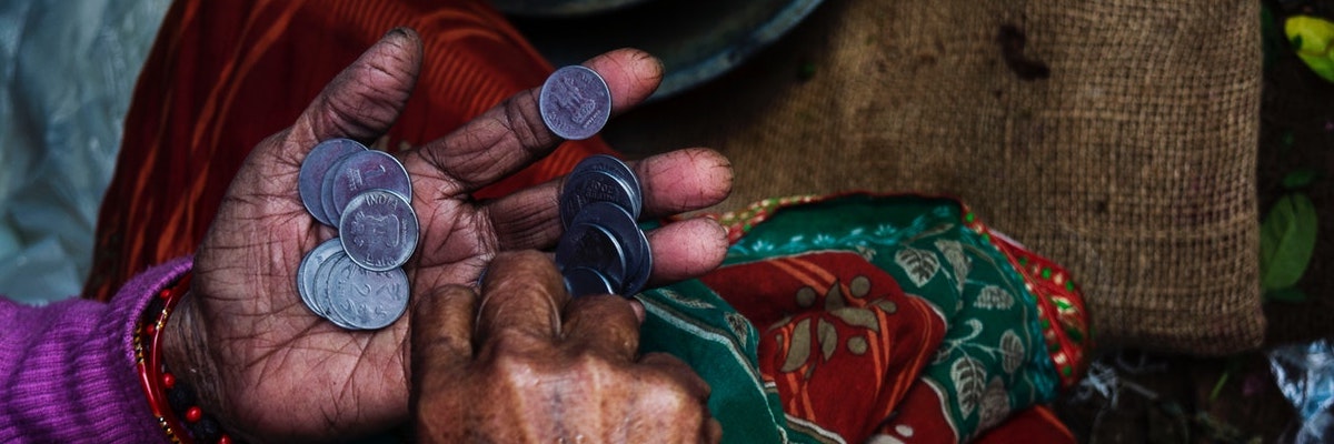 person-holding-coins-874684_1.jpg