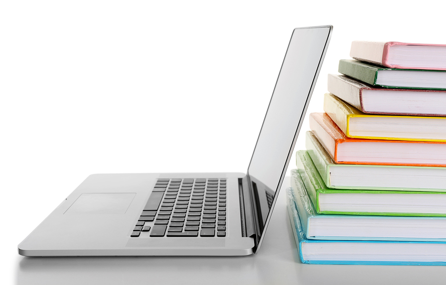 bigstock-stack-of-books-with-laptop-iso-97759727.jpg