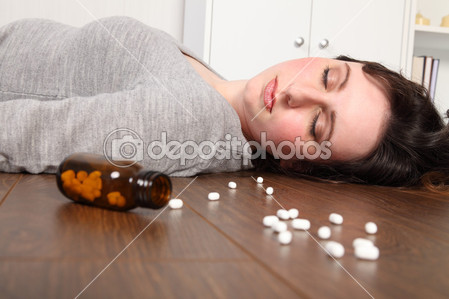 dep_6131926-Suicide-victim-takes-overdose-lying-on-floor.jpg