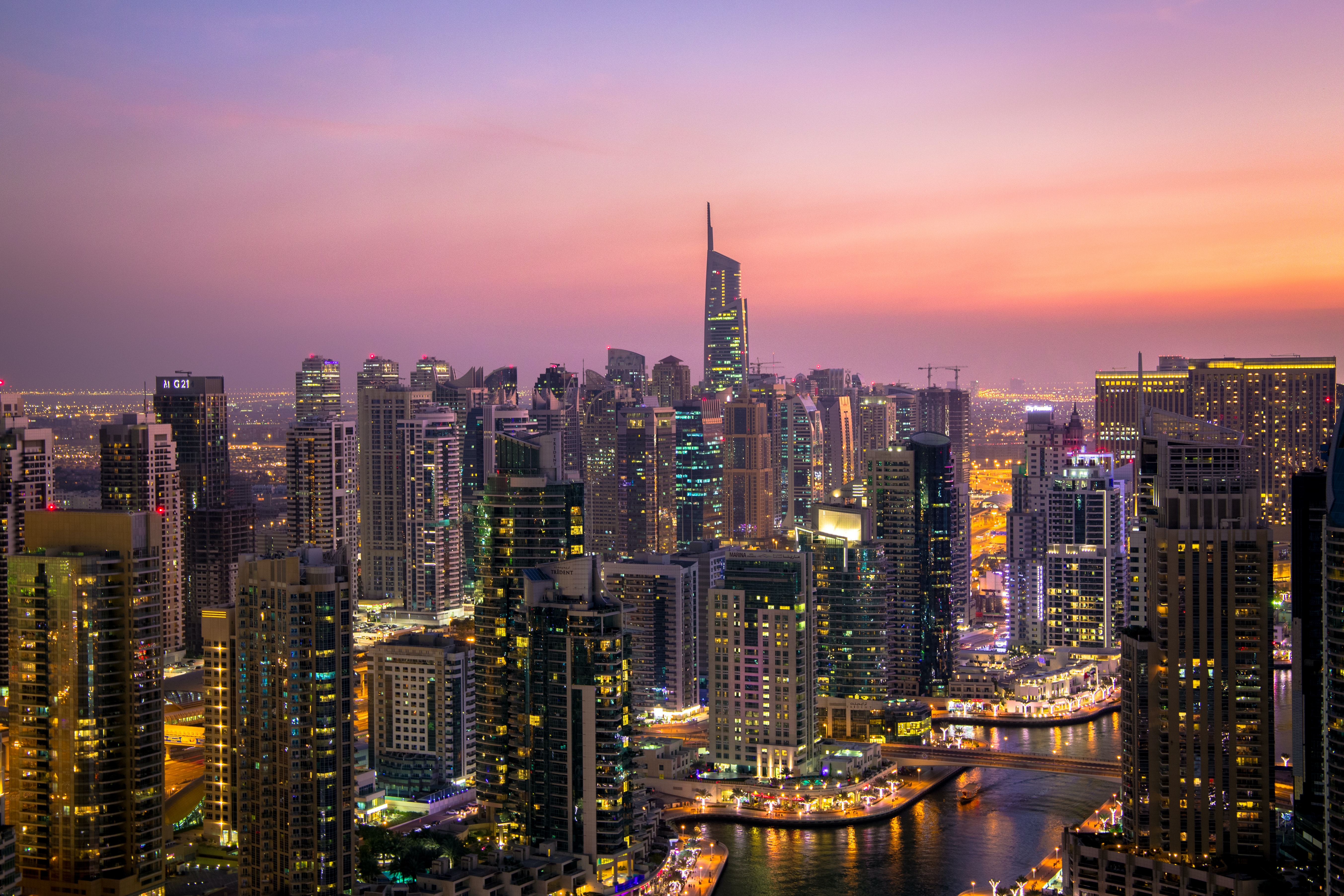 aerial-view-of-city-lit-up-at-night-325193.jpg