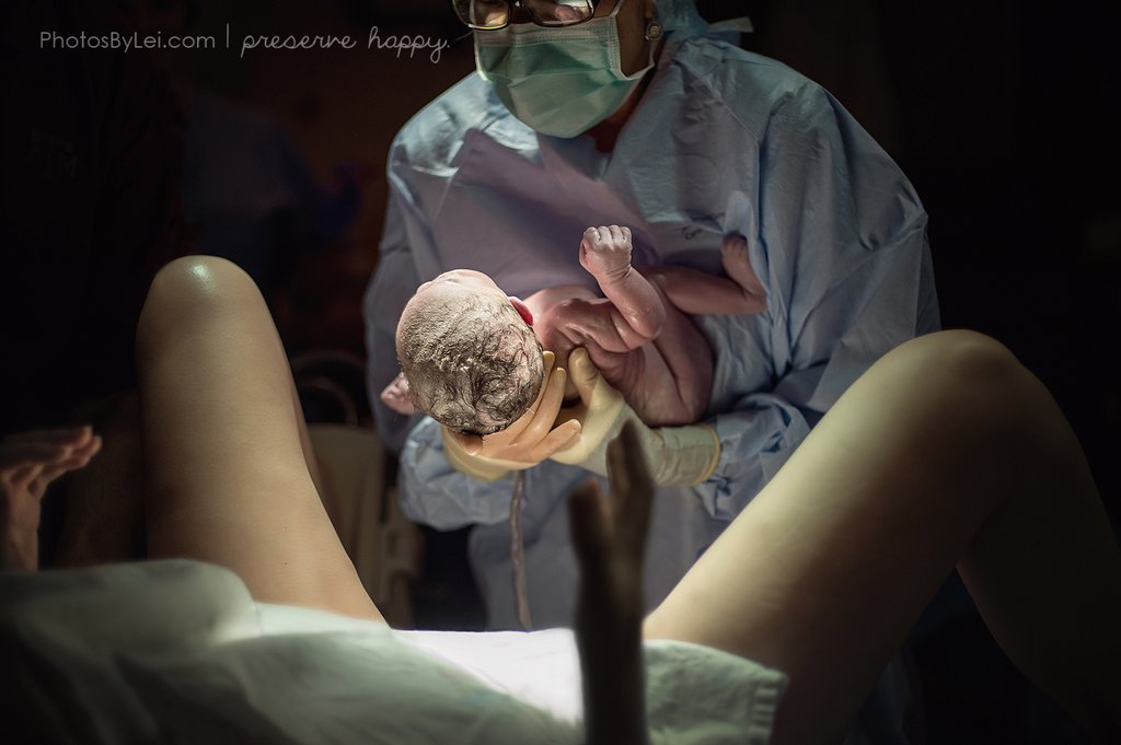 baby-passing-between-womb-her-mother.jpg