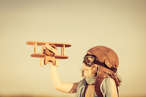 photodune-4789546-happy-kid-playing-with-toy-airplane-s.jpg
