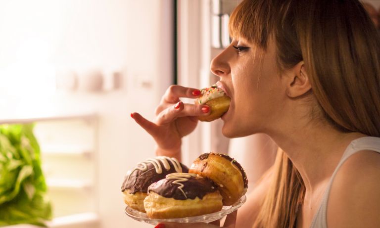 young-woman-having-a-midnight-snack-768.jpg