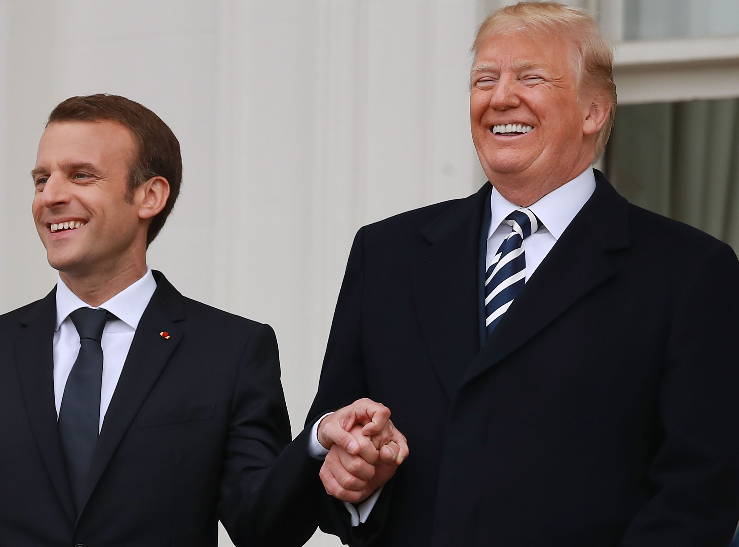 trump-macron-holding-hands-visit-9.jpg