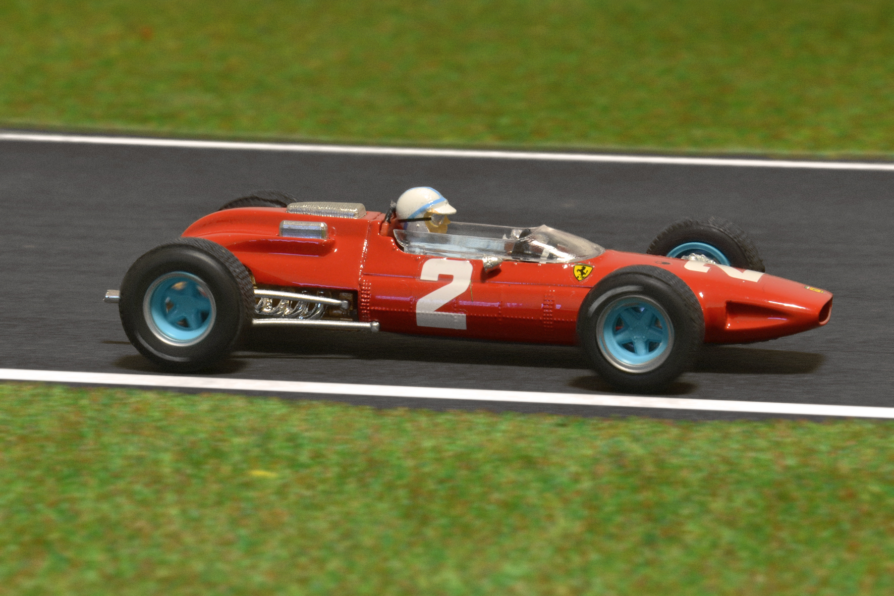 Év:1964<br />Modell: 158 <br />Pilóta: John Surtees<br />Gyártó: Brumm