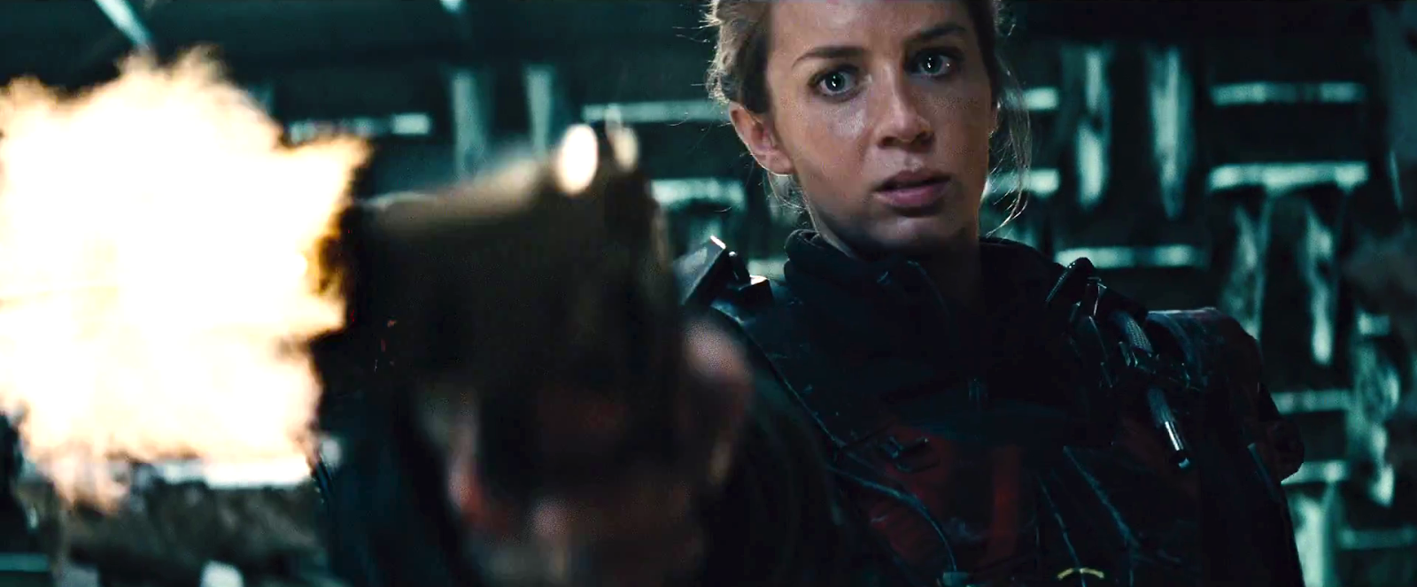 edge of tomorrow emily blunt shooting a gun at tom crusie off screen all you need is kill movie.png