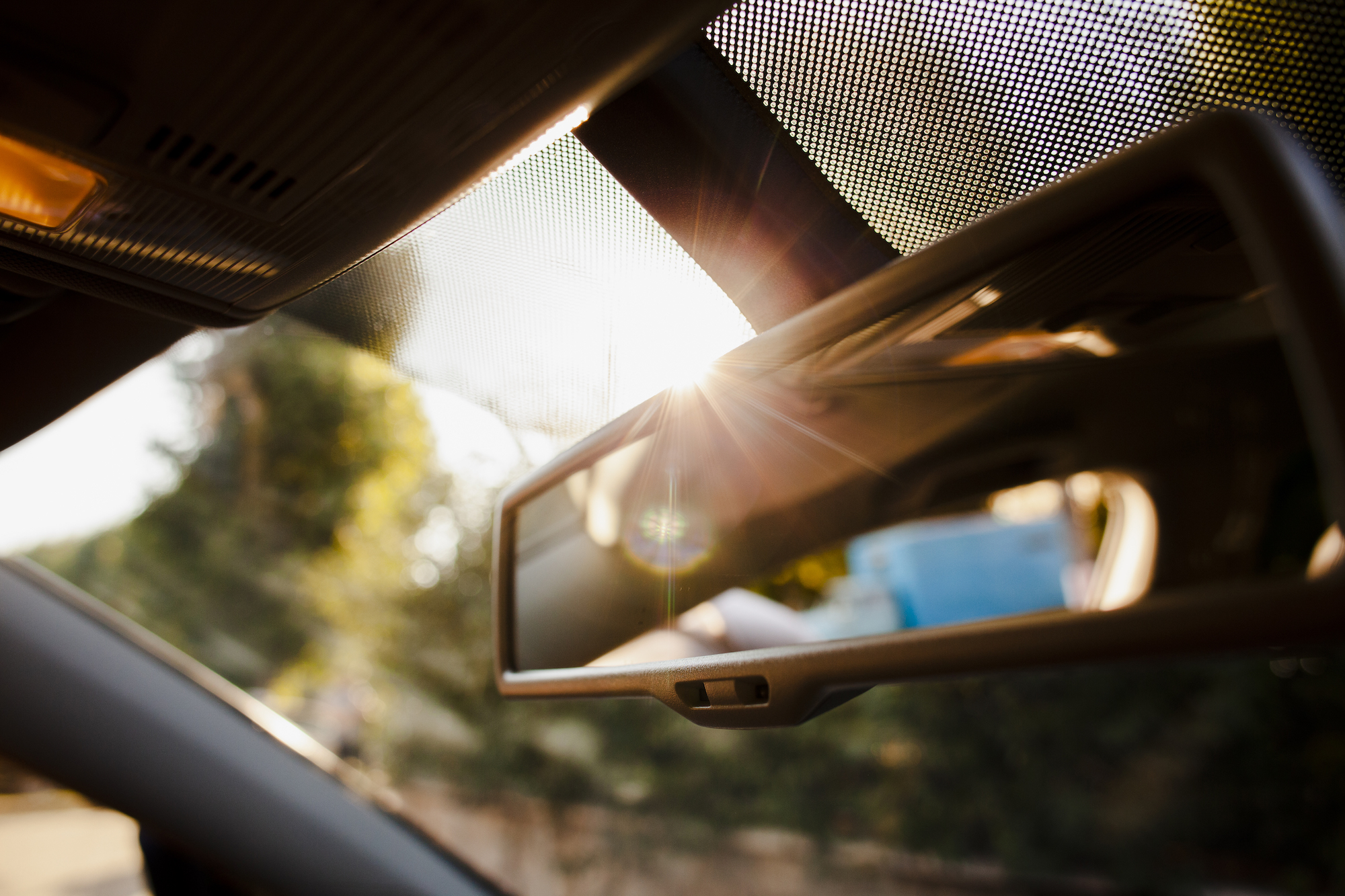 close-up-rearview-mirror-sunshine.jpeg
