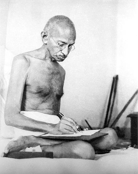 475px-Gandhi_writing_1942.jpg