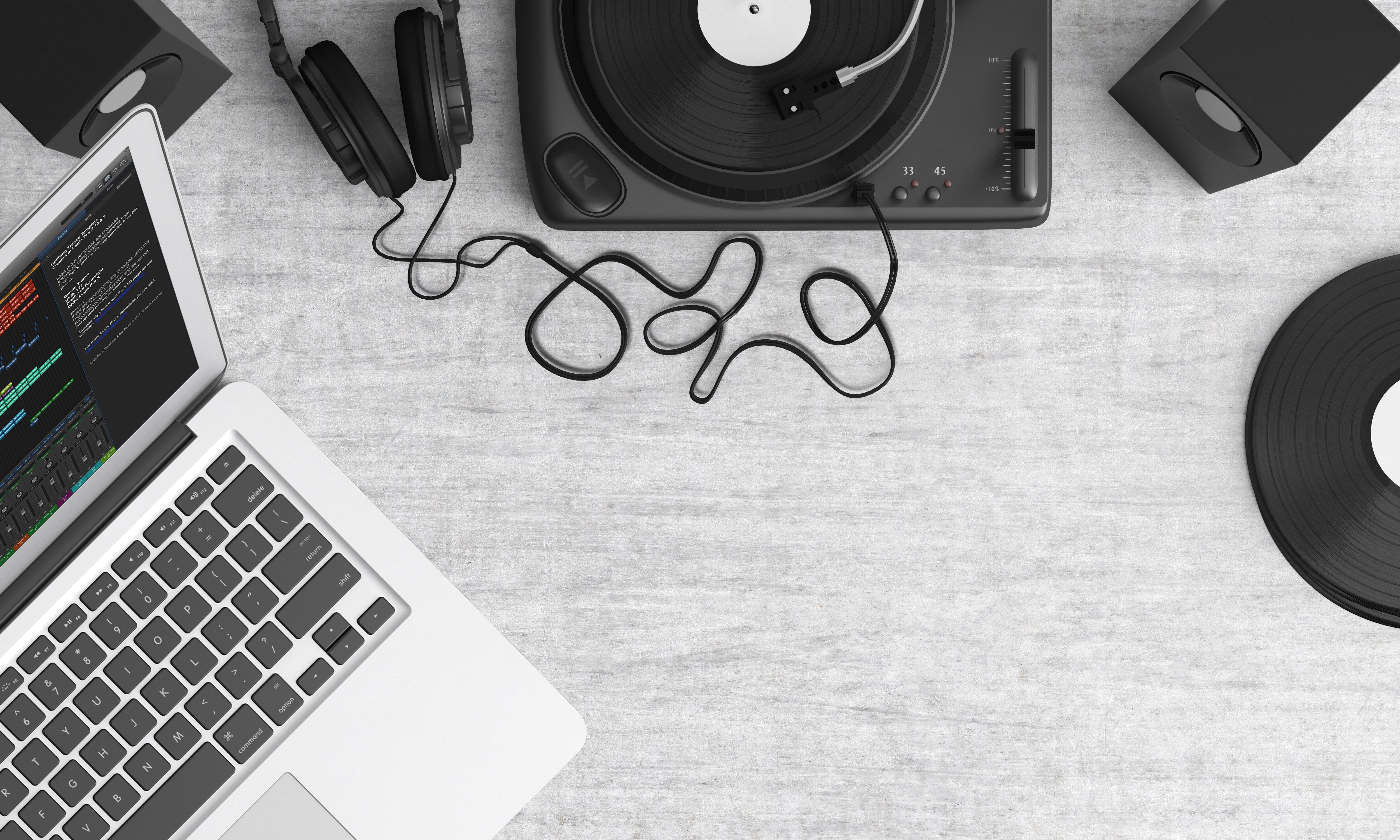 macbook-pro-beside-black-headphones-on-gray-table-159376.jpg