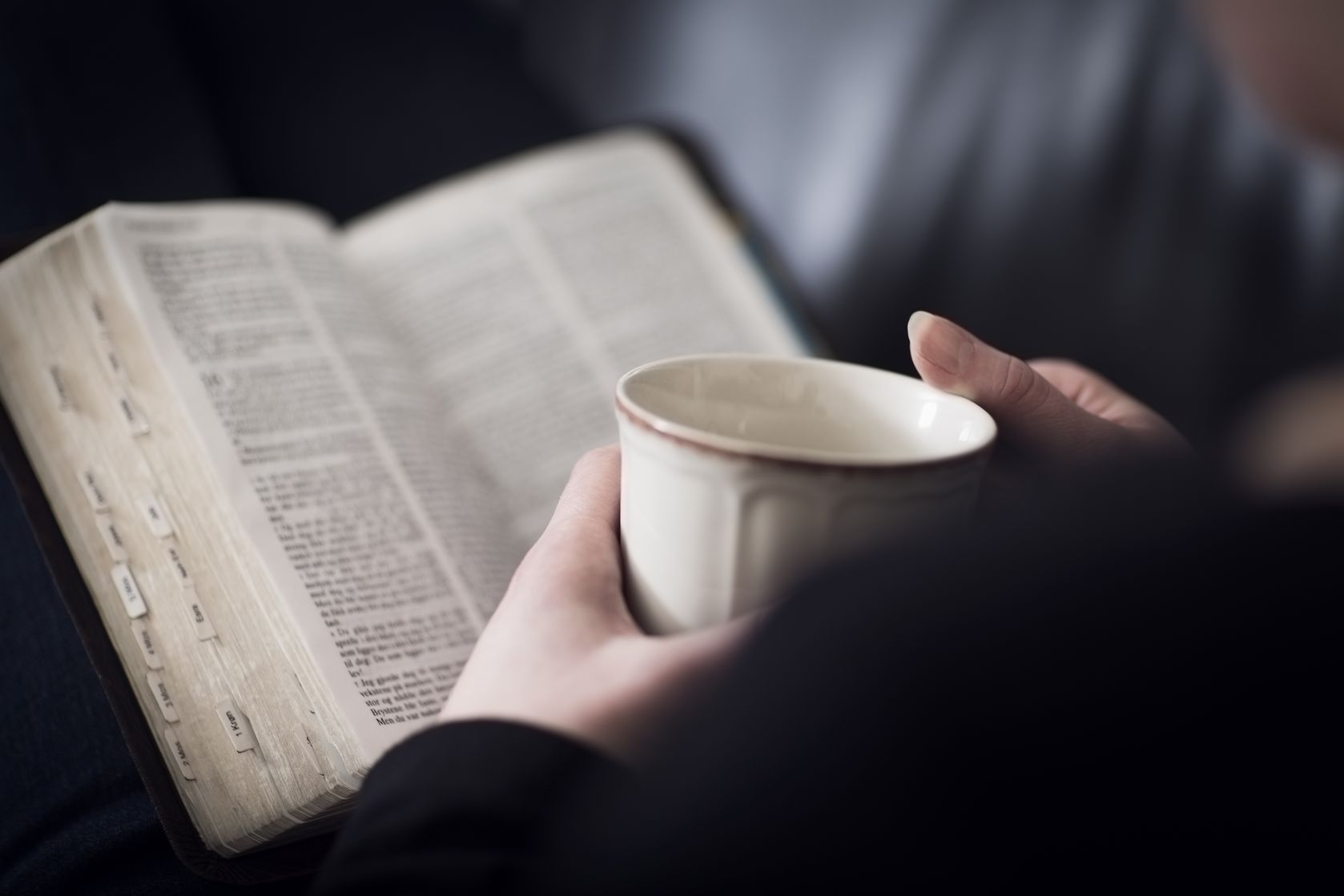 123rs19200854_ml-copy-woman-reading-biblecup-in-hand.jpg