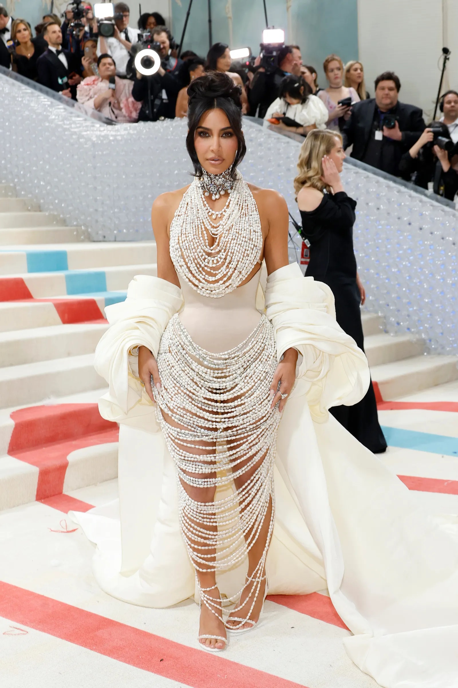kim_kardashian_pulled_all_the_stops_for_her_met_gala_look_this_year_collaborating_with_schiaparelli_s_daniel_roseberry_to_create_a_glamorous_gown_with_over_50_000_freshwater_pearls_and_16_000_crystals.jpg