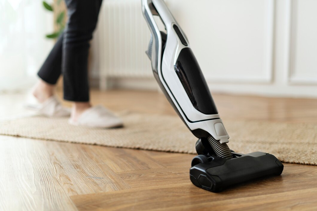 housewife-vacuuming-parquet-floor_53876-127258.jpg