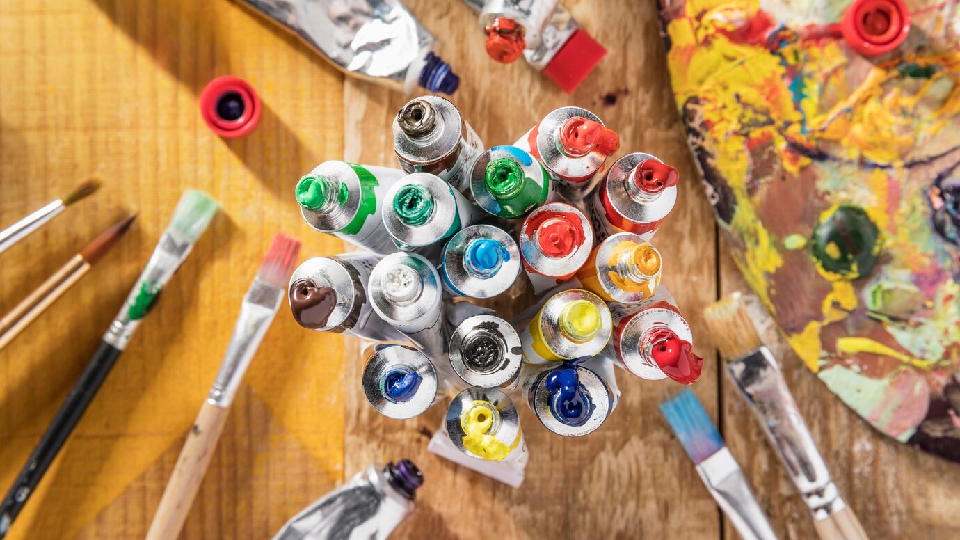 top-view-colorful-paint-tubes-with-paint-brushes_23-2148591216.jpg