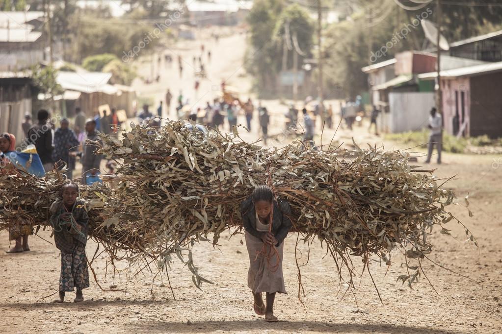 depositphotos_63083233-stock-photo-woman-and-child-with-heavy.jpg