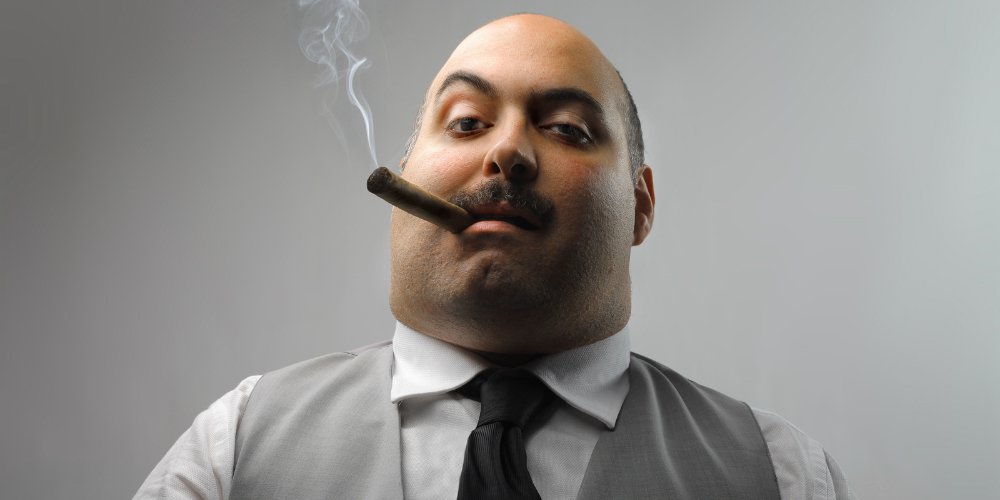 bigstock-portrait-of-man-smoking-cigar-12156542.jpg