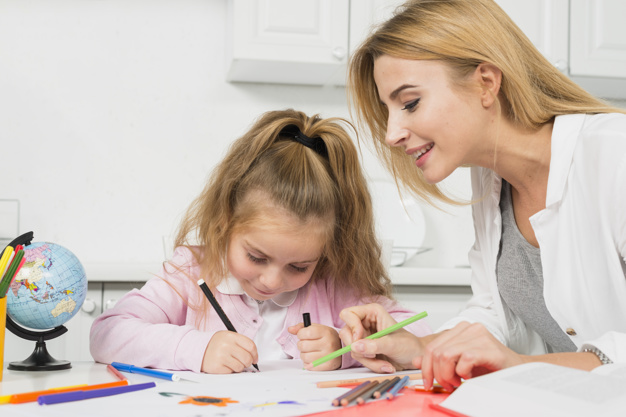 mother-helping-daughter-with-her-homework_23-2147997769.jpg