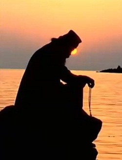 monk praying sunset.jpg