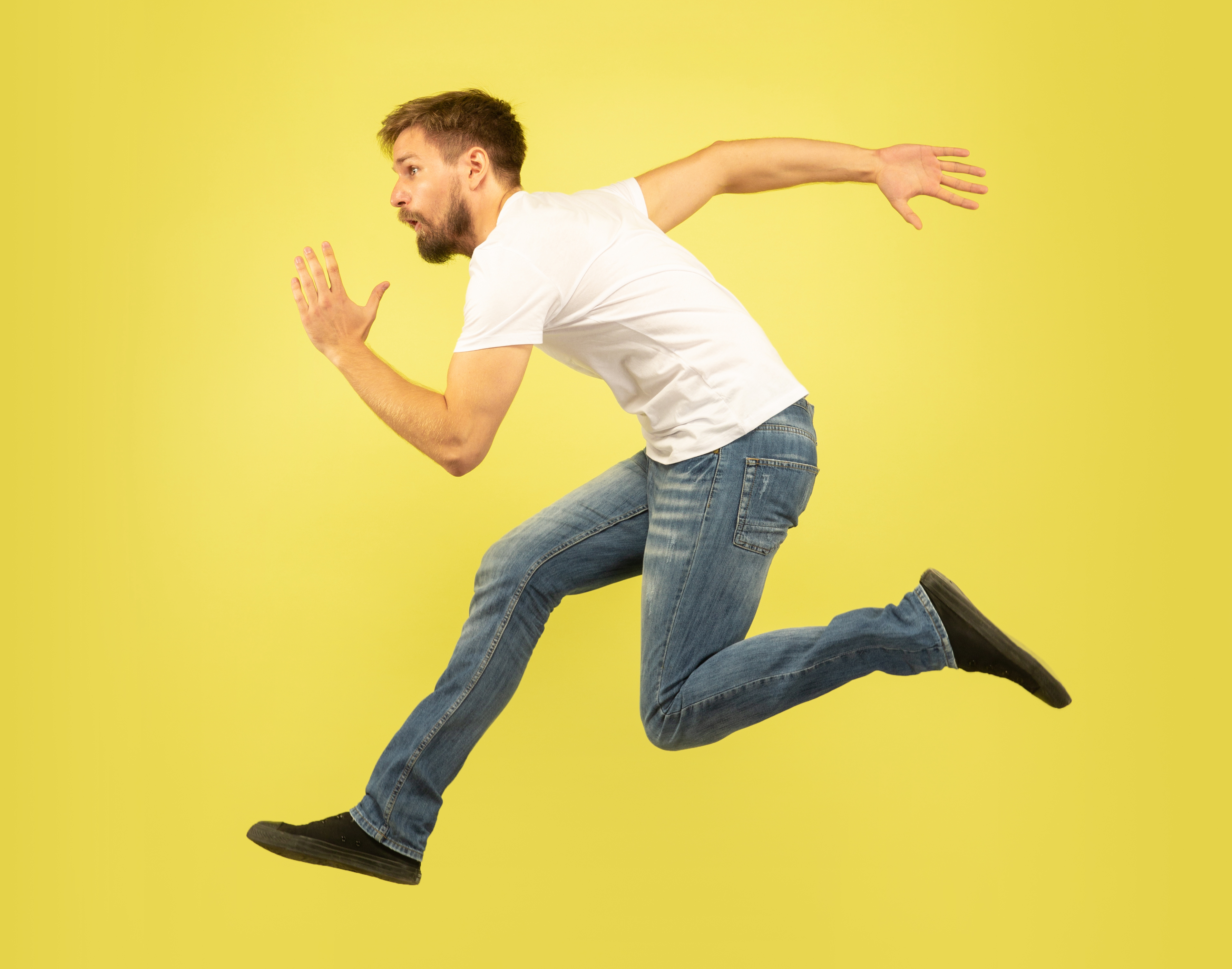 full-length-portrait-happy-jumping-man-isolated-yellow-background-caucasian-male-model-casual-clothes-freedom-choices-inspiration-human-emotions-concept-run-sales-hurry-up.jpg