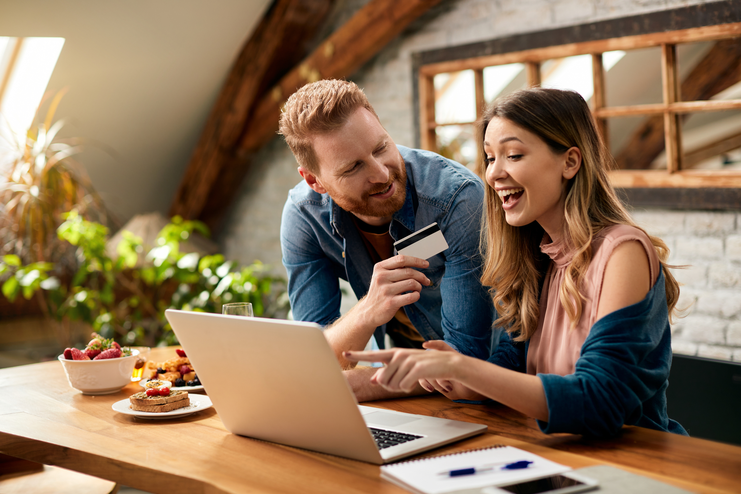 happy-couple-having-fun-while-online-shopping-home.jpg