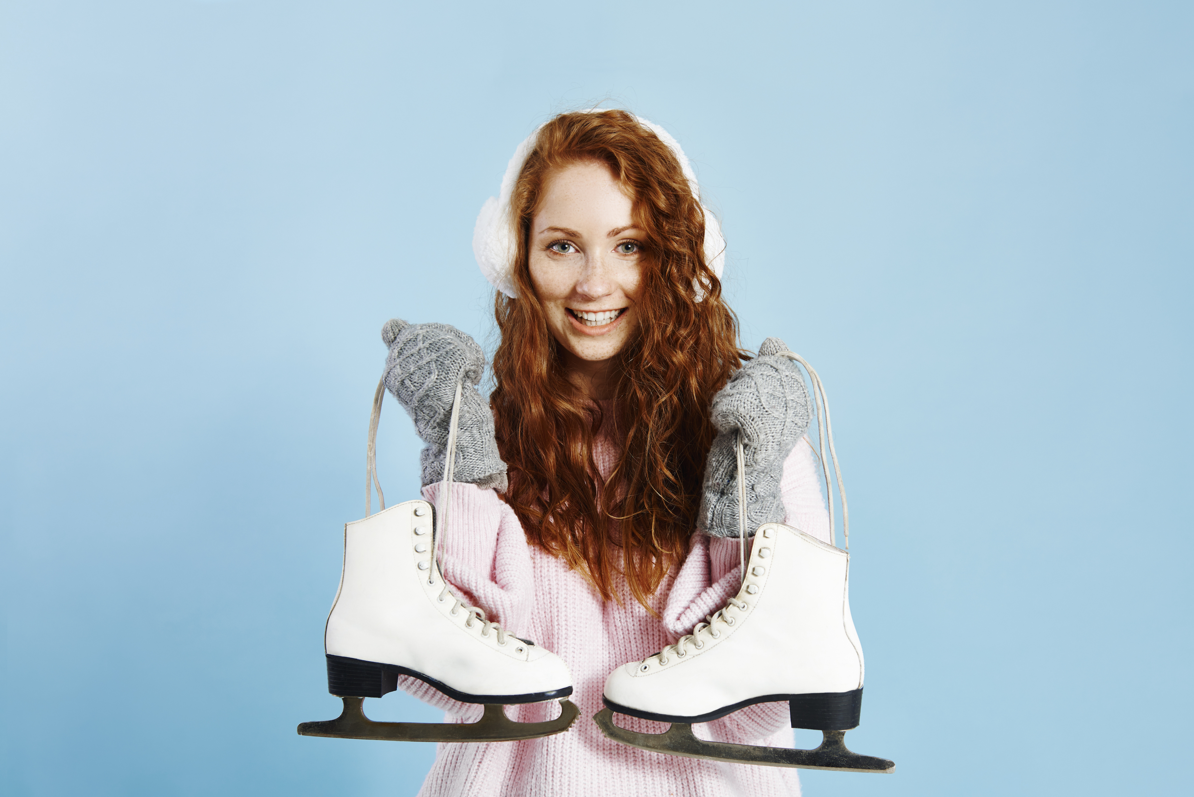 portrait-smiling-girl-holding-ice-skates.jpg