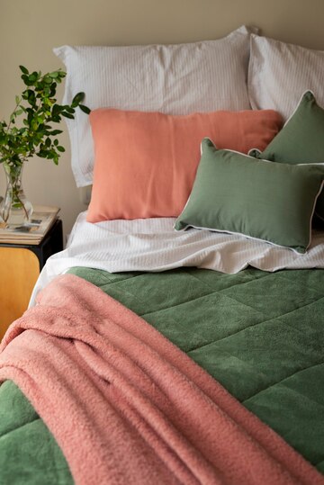 high-angle-cozy-bed-arrangement_23-2150326152.jpg