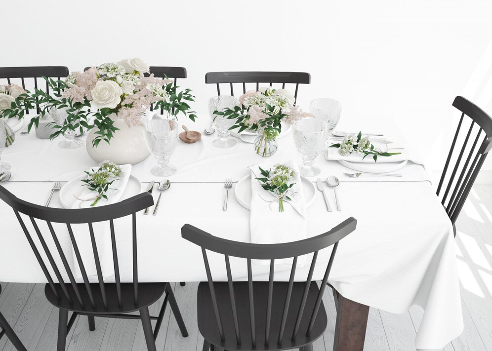 table-prepared-eat-with-cutlery-decorative-flowers_176382-582.jpg