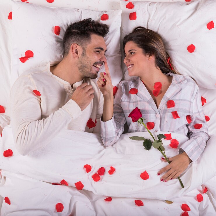 woman-with-rose-touching-man-nose-bed_23-2148024052.jpg