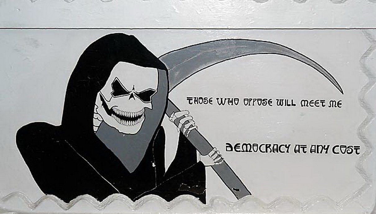 Aki ellenáll, velem találkozik. Demokrácia mindenáron. A kép a Wisconsin egyik lövegtornyát ékesíti.