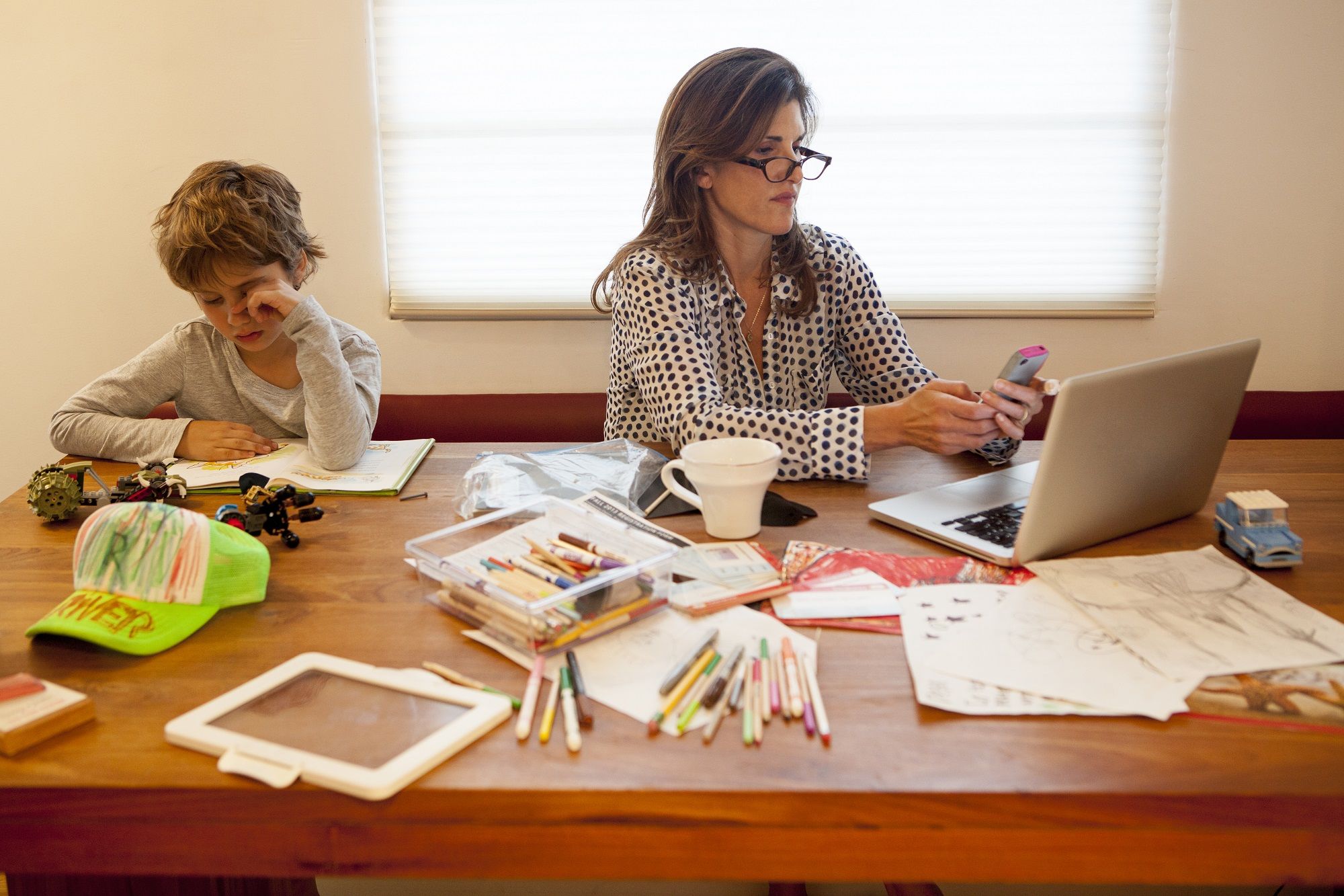 104568243-mother_and_son_working_at_table.jpg