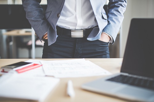 businessman-standing-in-his-office-picjumbo-com.jpg