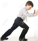 4111896-image-of-schoolboy-making-great-effort-while-setting-against-wall-stock-photo.jpg