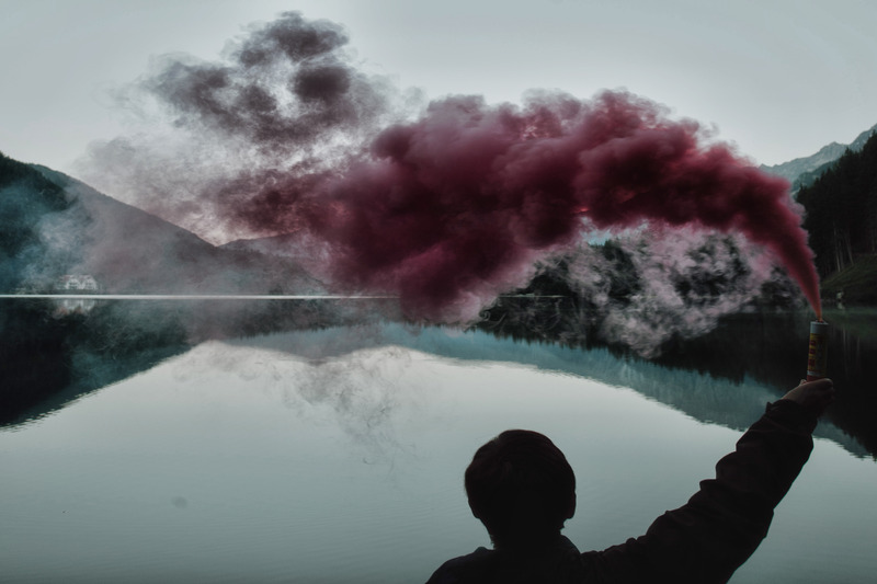 canva-person-holding-smoke-bomb-madgv8nxfem.jpg