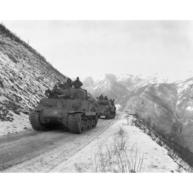 m-4a3-sherman-tank-convoy-travels-along-a-well-graded-but-narrow-road-coming-up-funchilin-pass-on-nov-19-history.jpg
