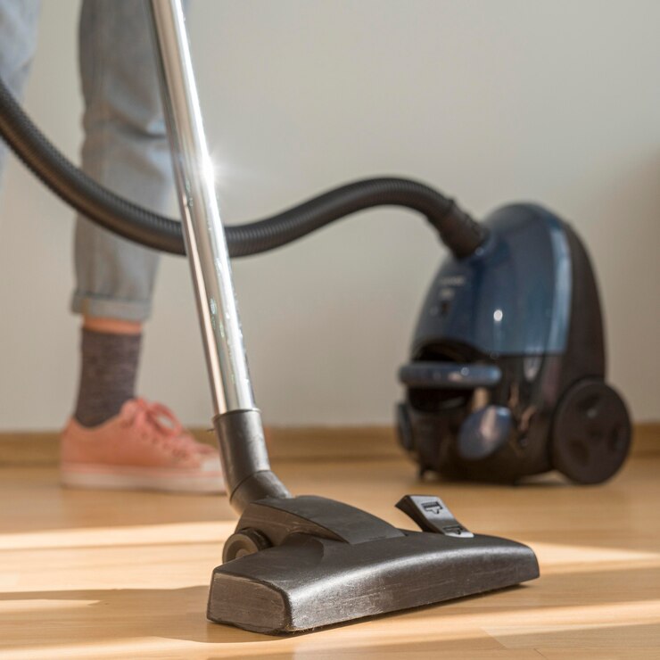 woman-cleaning-room-with-vacuum-cleaner_23-2148587297.jpg