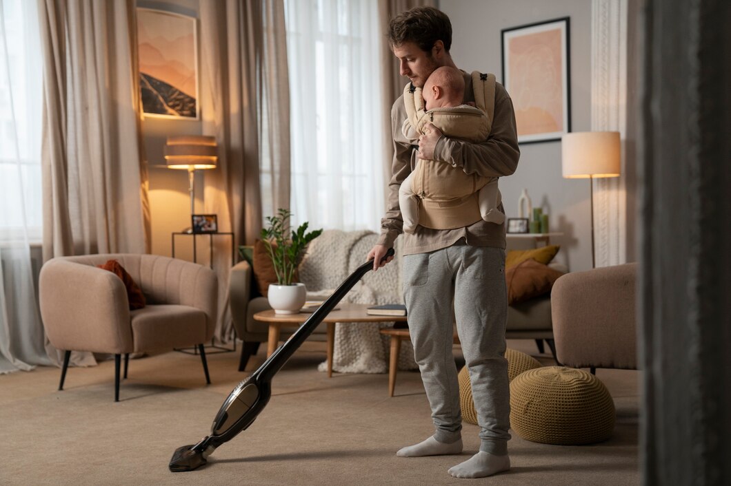full-shot-father-holding-baby-while-vacuuming_23-2150166588.jpg