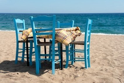 7975093-greek-beach-with-traditional-blue-table-and-chairs.jpg