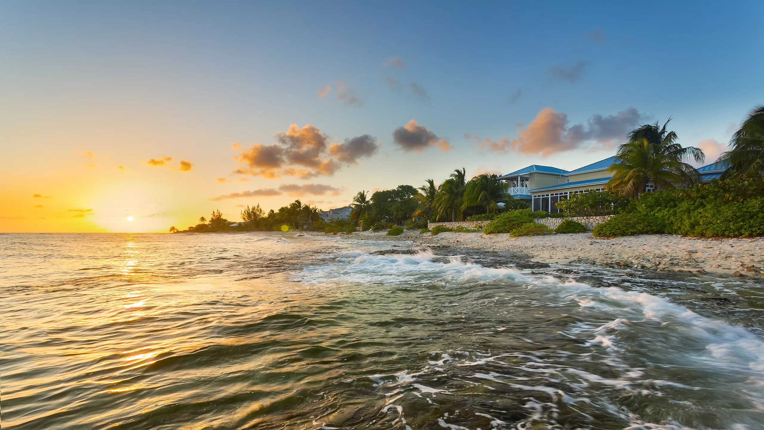 grandcayman_res_shutters_beachherosunset_2560.jpg