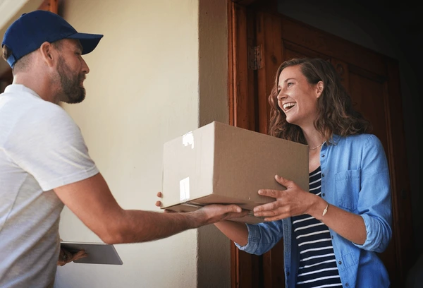 happy-woman-delivery-man-package-600nw-2304125563.webp