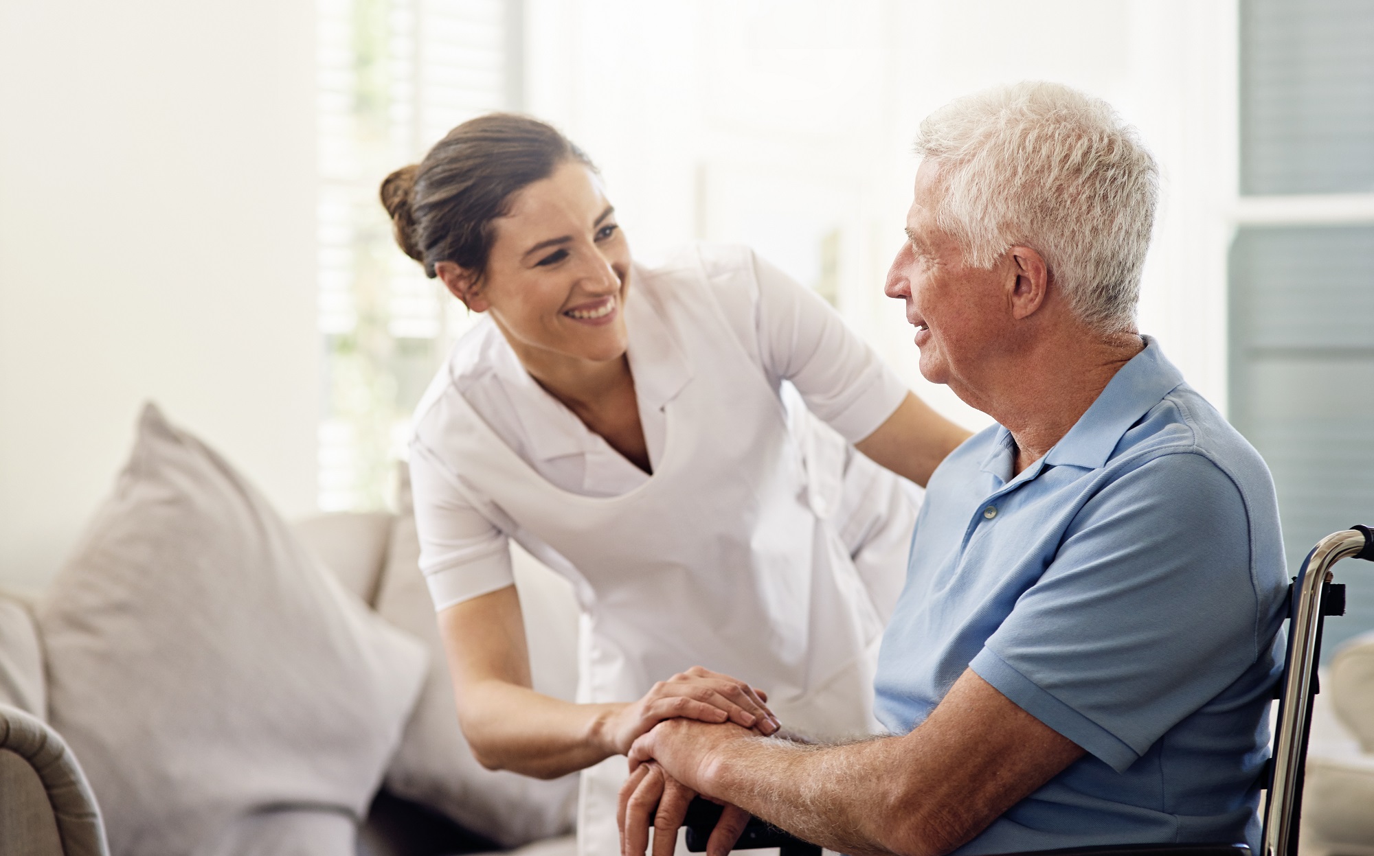 shot-of-a-caregiver-helping-a-senior-man-in-a-whee-2022-12-14-03-10-34-utc-1-1.jpg
