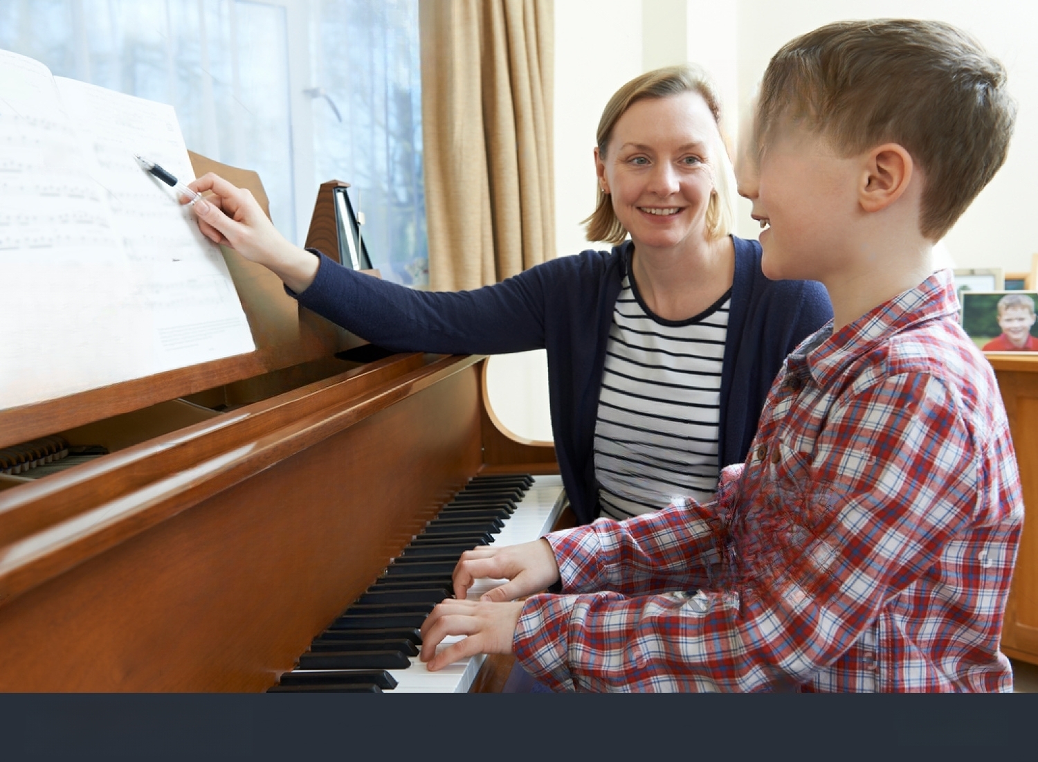 stock-photo-boy-with-music-teacher-having-lesson-at-piano-516088930-transformed.jpeg