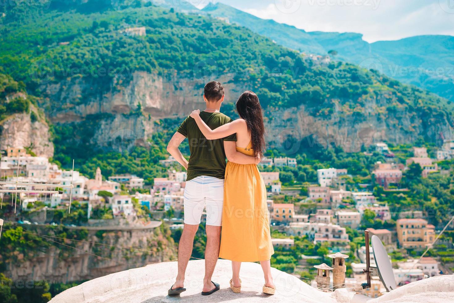young-family-with-positano-village-on-the-background-amalfi-coast-italy-summer-holiday-in-italy-photo.jpg