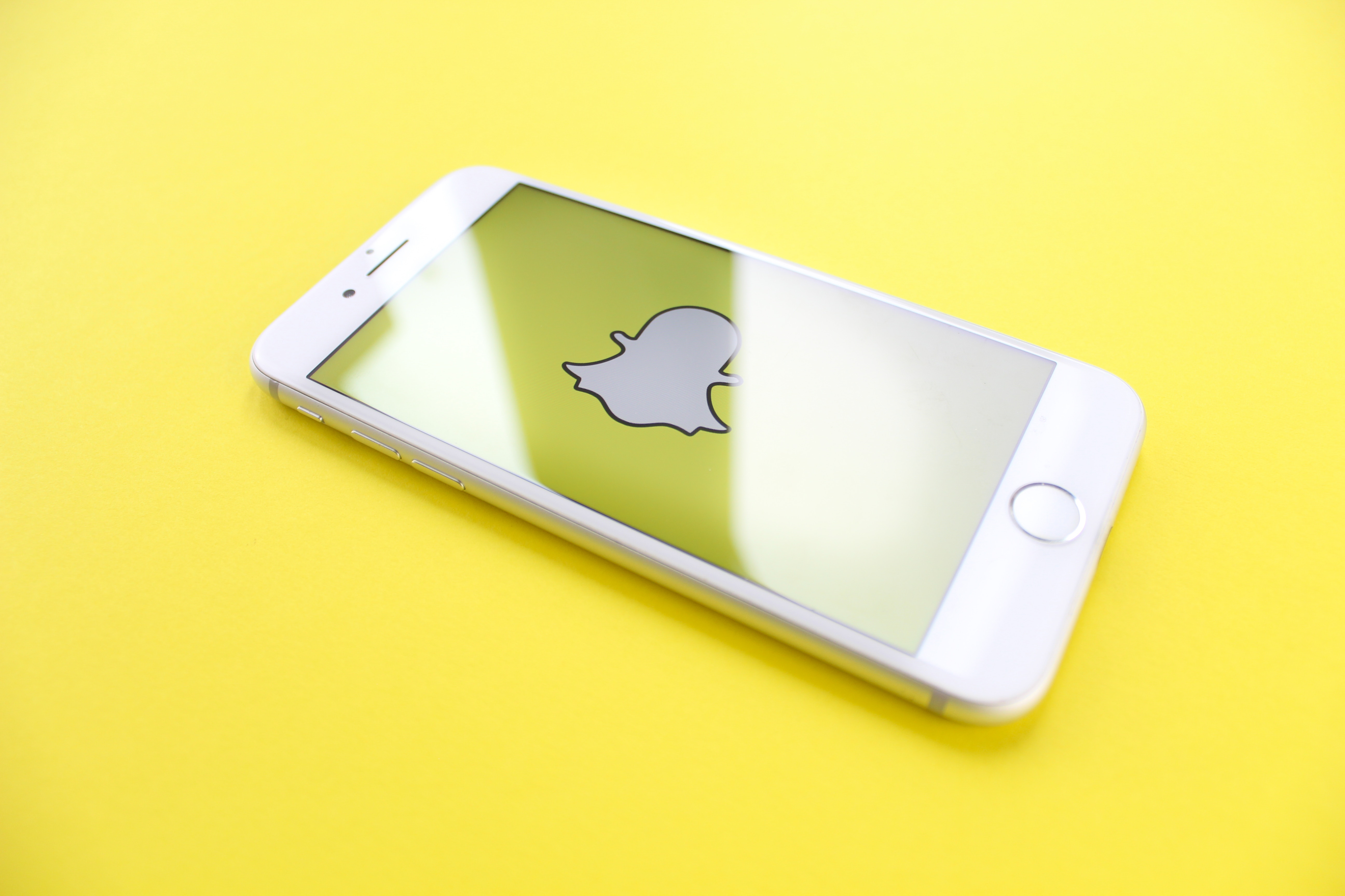 iphone-on-yellow-surface-2228569.jpg