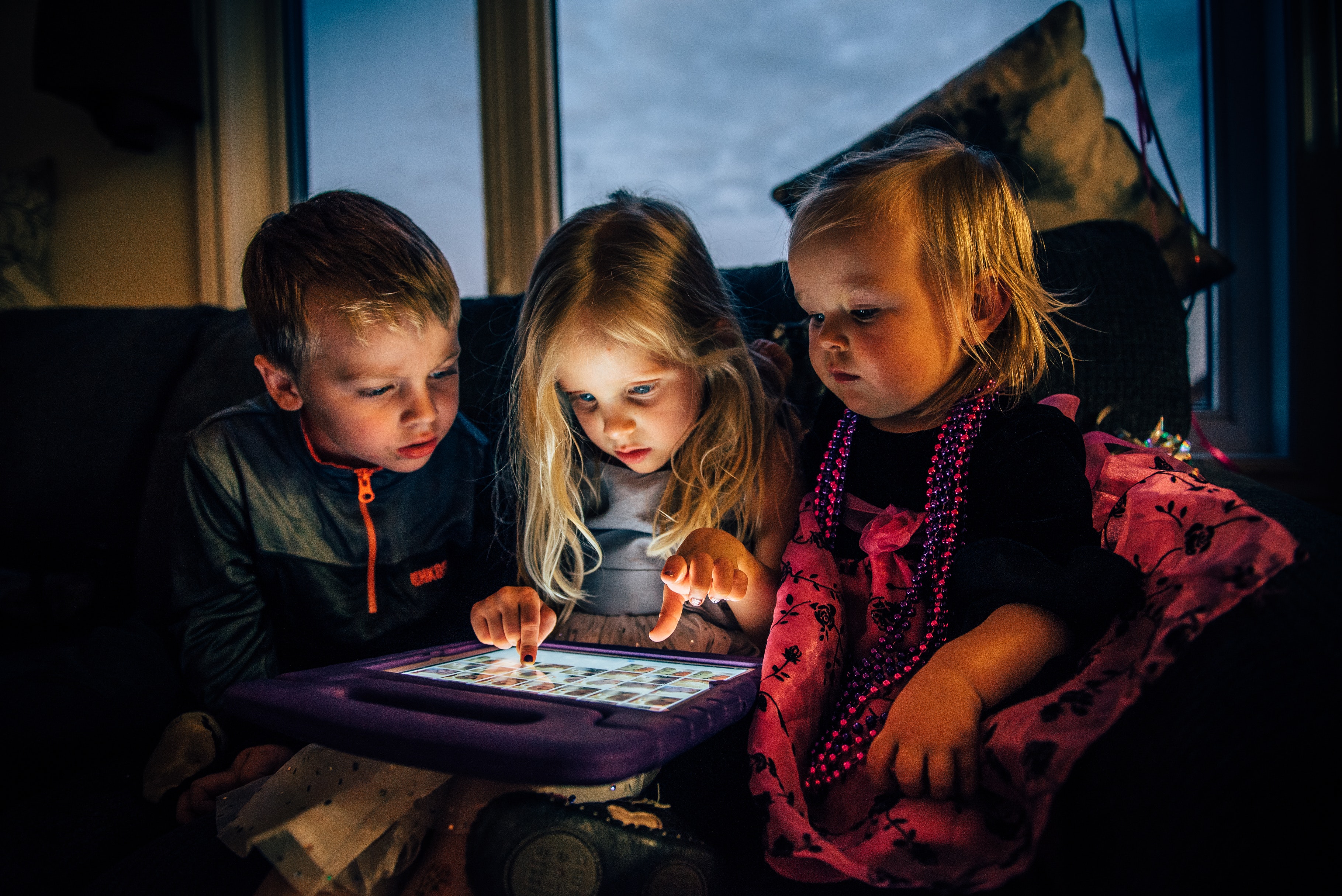 three-children-looking-at-a-tablet-computer-3536480.jpg